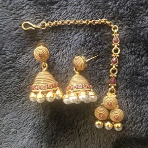 Gold earrings with matching bindi